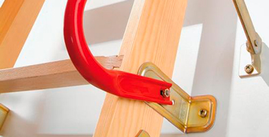 Accessories and spare parts, including metal and wooden components, for loft ladder maintenance or upgrades.