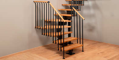 A staircase with winder treads featuring elegant handrail banisters, perfect for maximizing space with style.