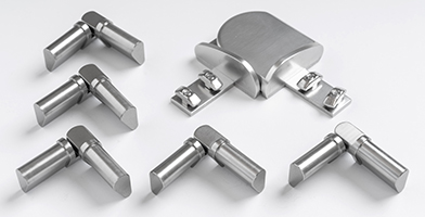 A selection of metal accessories, including corner joints and connectors, for balustrade assembly.