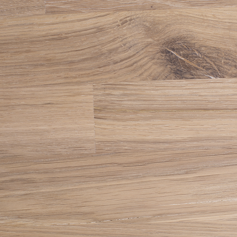 Close-up of white oiled solid oak wood, featuring a bright tone with a smooth grain pattern.