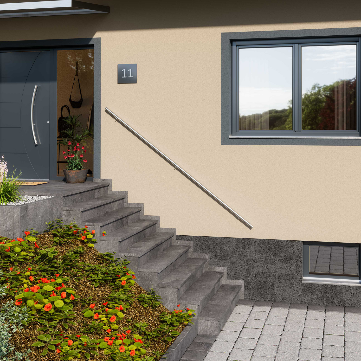 Exterior staircase with a sleek metal handrail leading to the entrance of a modern house with beige walls and a dark door.